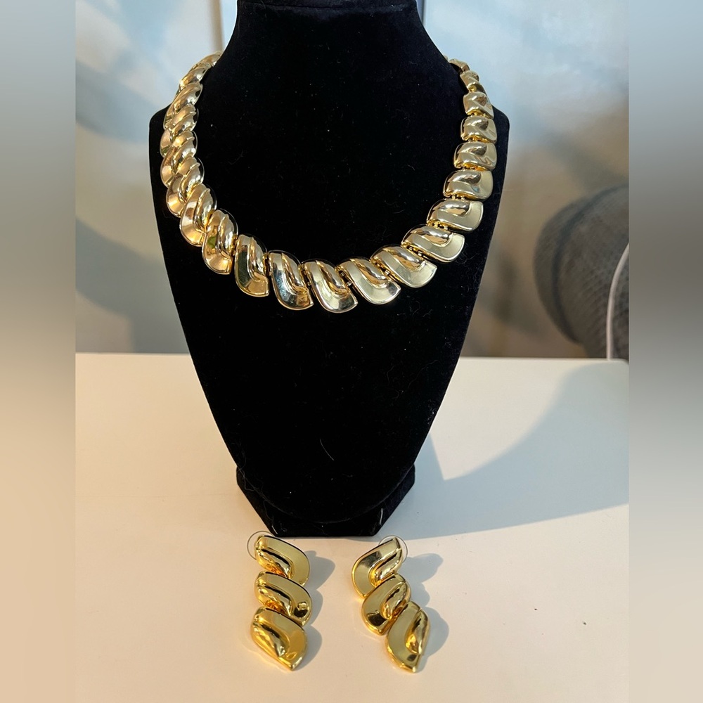 Gold tone choker and earrings. Pierced earrings 2” long, necklace 15”. Shiny.